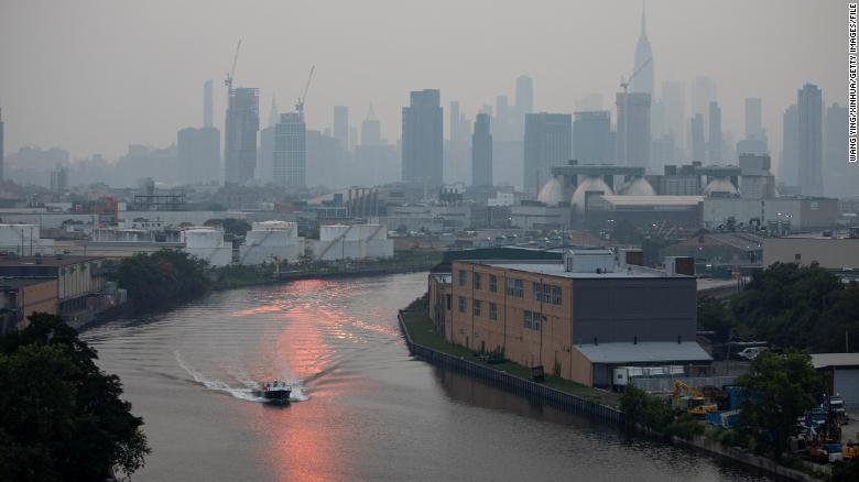  The Manhattan skyline is shrouded in a thick haze as a result of smoke from the western wildfires, July 2021. 